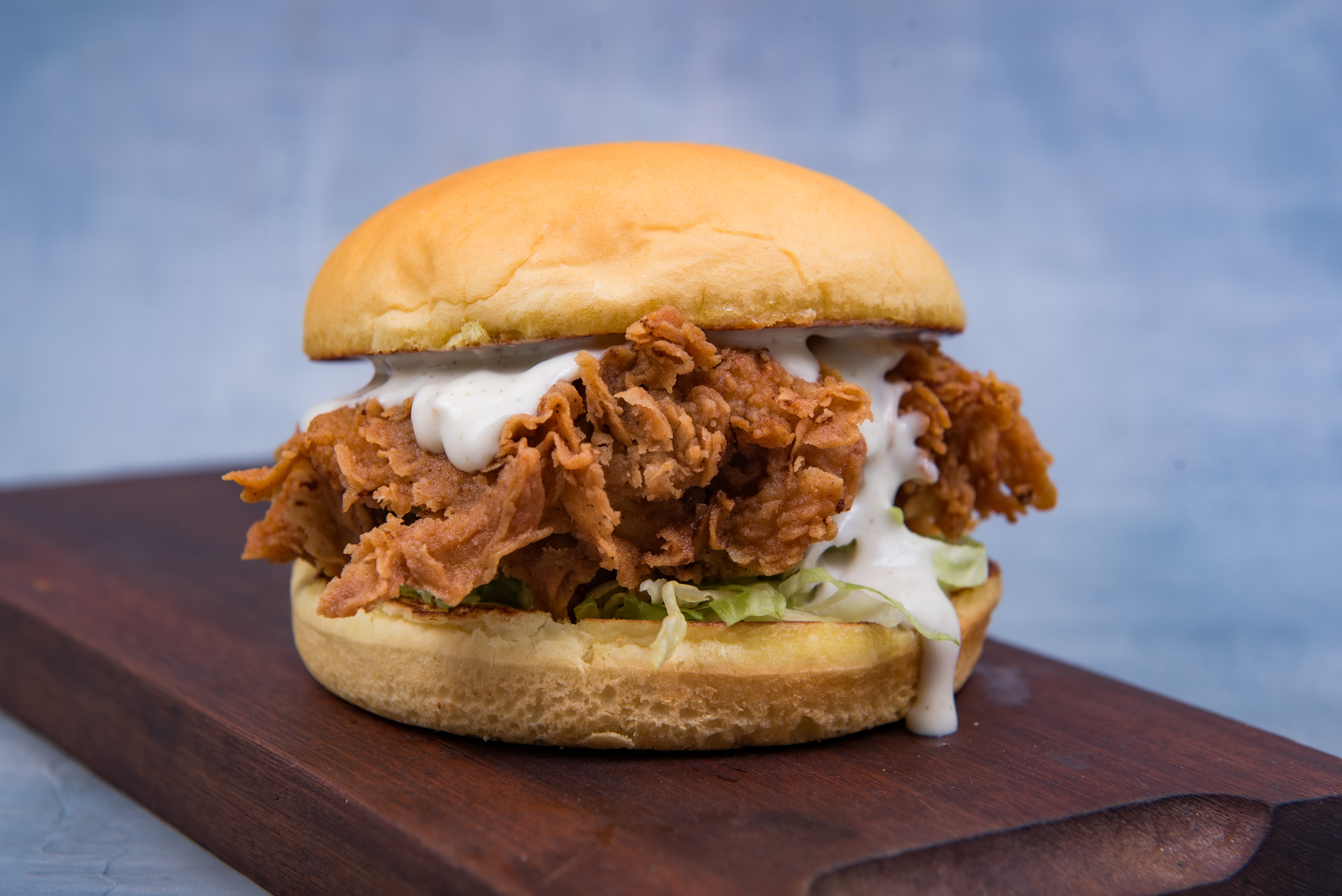 B60 Classic Chicken burger — crispy fried chicken, sauce, lettuce